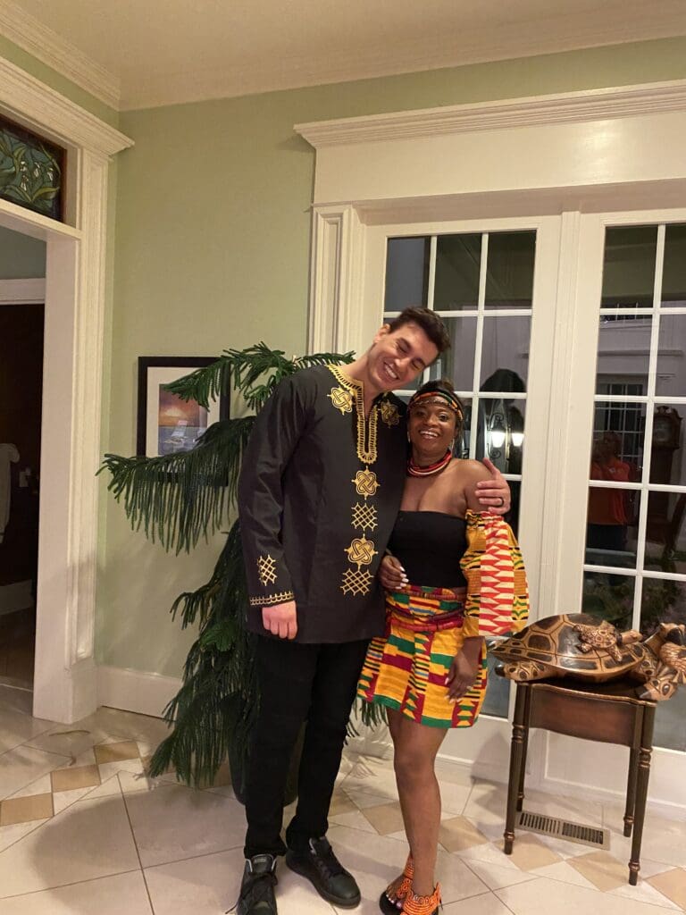 Couple changed into traditional dress. Bride is wearing her mother's wedding dress from Ghana.