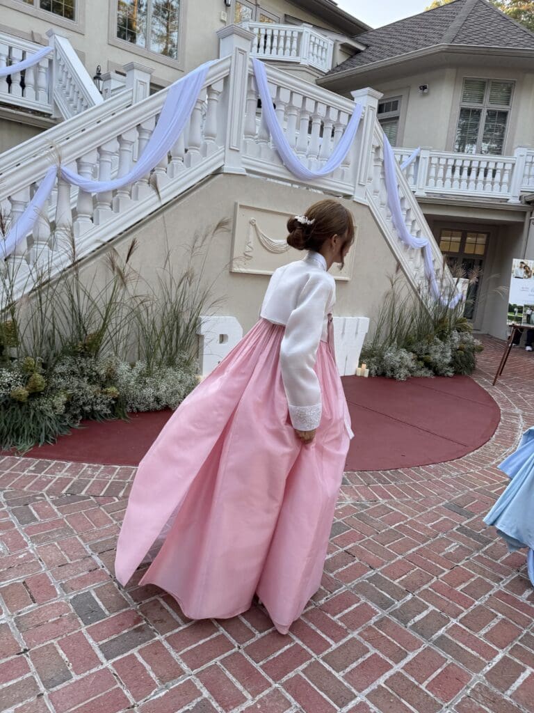 The bride changed into a traditional Korean wedding dress (hanbok) to honor her new In-laws