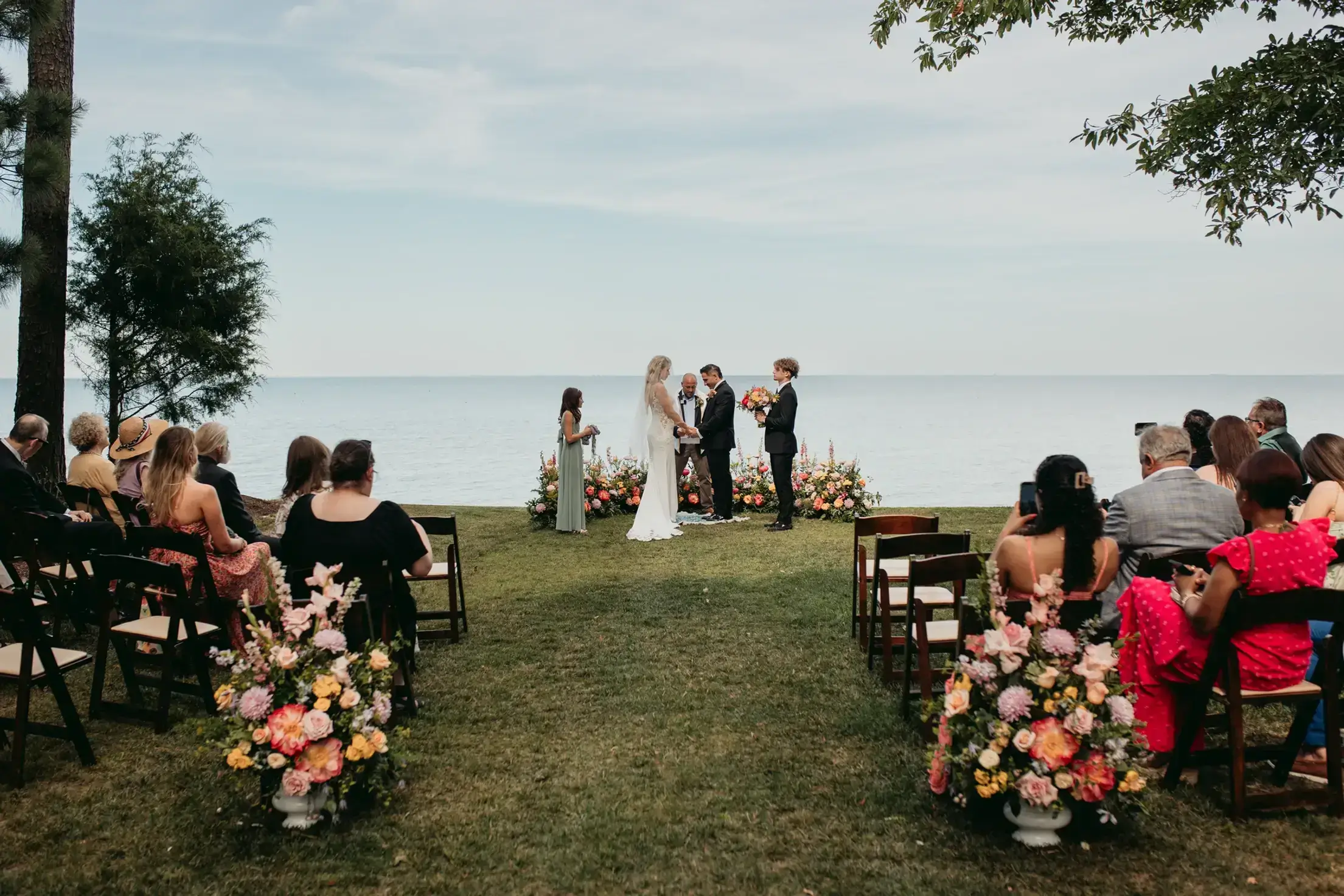 Outdoor wedding ceremony by the sea.
